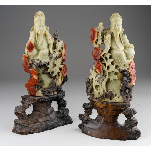 1014 - A pair of Chinese carved soapstone figures of deities on separate bases, height 25.5cm (2)