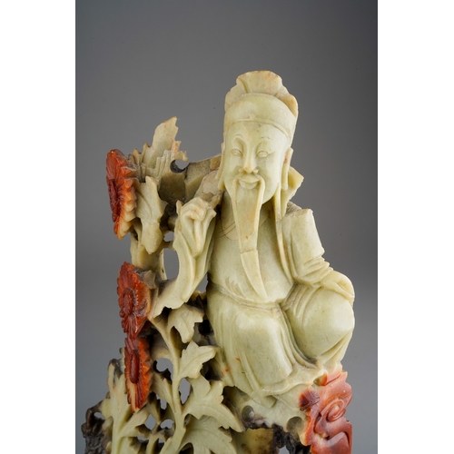 1014 - A pair of Chinese carved soapstone figures of deities on separate bases, height 25.5cm (2)