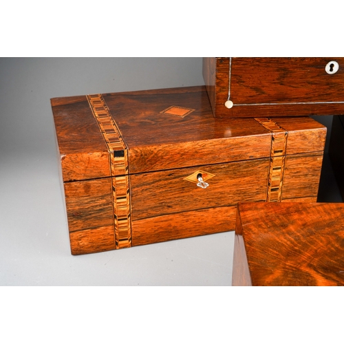 1026 - Four Victorian work boxes of rectangular form, all lacking internal fittings, one in rosewood with m... 