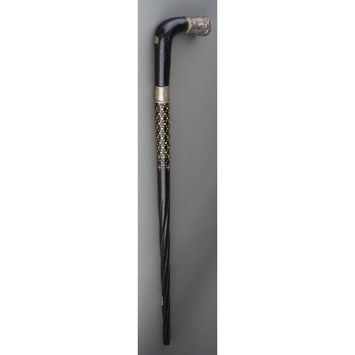 1028 - A late 19th century ebony and bone inlaid walking stick, the handle with white metal mount (soldered... 