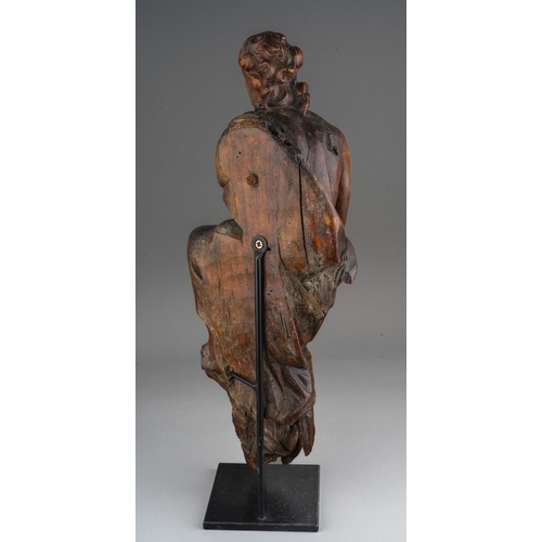 1029 - A 15th Century carved wood Northern European male figure kneeling and wearing draped robes, circular... 