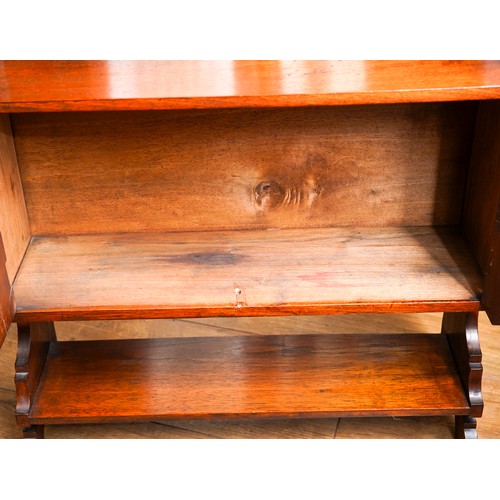 952A - A late Victorian walnut wall hanging cabinet, the raised back with turned gallery, the shelf support... 