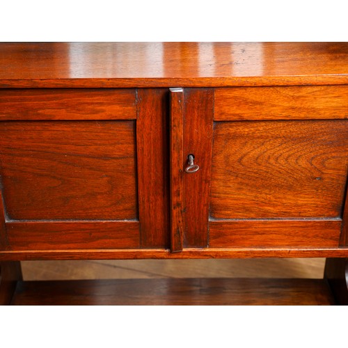 952A - A late Victorian walnut wall hanging cabinet, the raised back with turned gallery, the shelf support... 