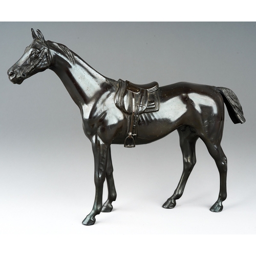 75 - A modern bronzed figure of a saddled horse, cast initials SP to underside, height 24cm