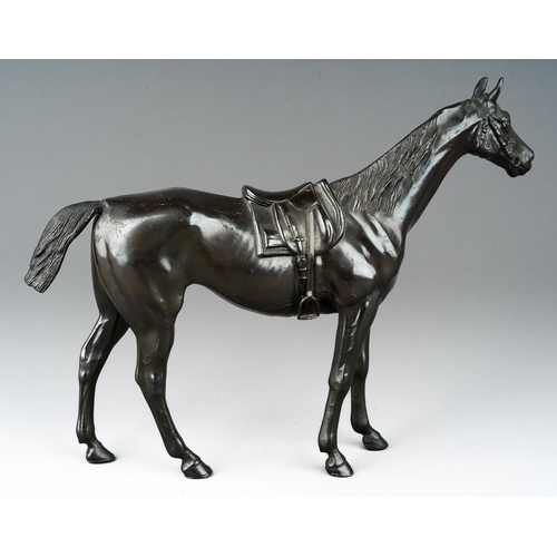 75 - A modern bronzed figure of a saddled horse, cast initials SP to underside, height 24cm