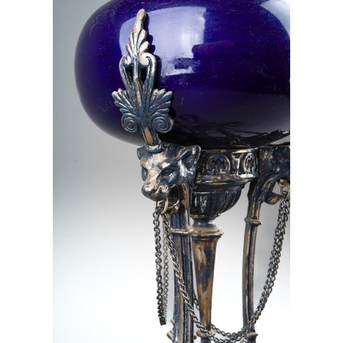 84 - A Neo-Classical silver plated oil lamp, with blue glazed ceramic reservoir, on monopodia base, with ... 