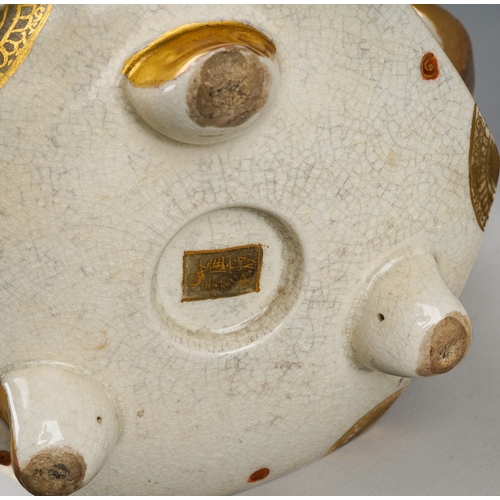 100 - A Japanese Satsuma pottery Meiji period (1868 to 1912) tea pot of waisted hexagonal form on three sh... 