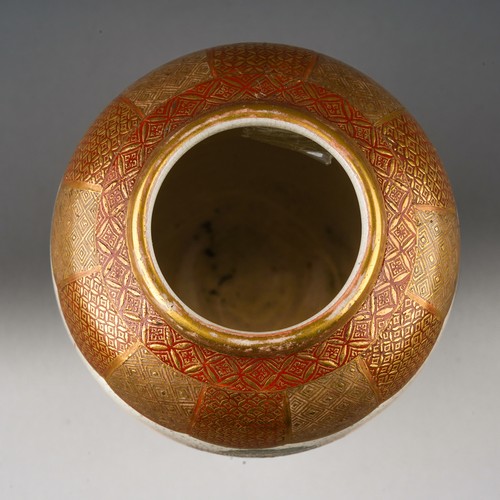 106 - A small Japanese Satsuma pottery vase of ovoid form on three short legs, hand decorated with a conti... 