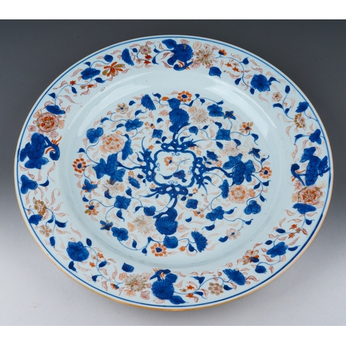 116 - A Chinese porcelain Kangxi charger in the Imari palette with gilt highlights, foliate decoration, ex... 