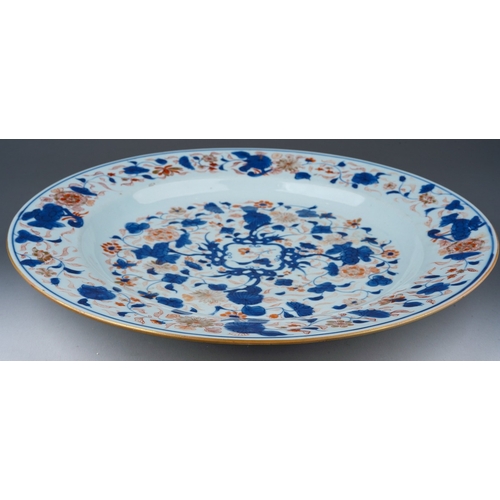 116 - A Chinese porcelain Kangxi charger in the Imari palette with gilt highlights, foliate decoration, ex... 