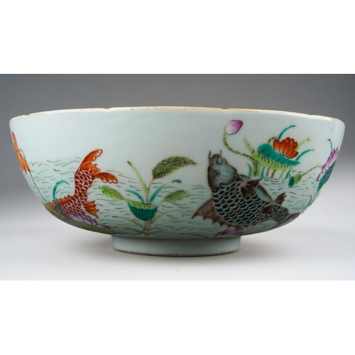 120 - A Chinese porcelain bowl, lobed rim, plain interior, the exterior polychrome enamelled with carp swi... 
