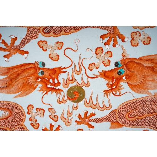 124 - A Chinese iron-red two dragon charger, Guangxu (1875-1908), of circular form, painted with two drago... 