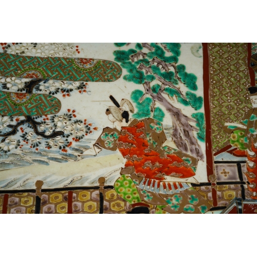 125 - A large Japanese porcelain charger, Meiji period (1868-1912), the turquoise ground border polychrome... 