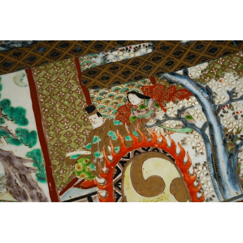 125 - A large Japanese porcelain charger, Meiji period (1868-1912), the turquoise ground border polychrome... 