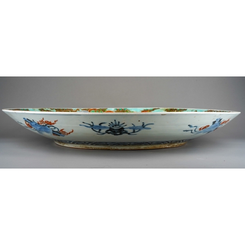 125 - A large Japanese porcelain charger, Meiji period (1868-1912), the turquoise ground border polychrome... 