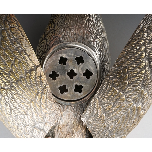 129 - A 20th century silver plated flower holder in the form of a swan, red paste eyes, the hinged wings o... 