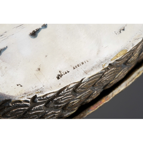 129 - A 20th century silver plated flower holder in the form of a swan, red paste eyes, the hinged wings o... 