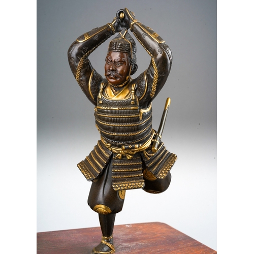 130 - A Japanese Meiji period (1868-1912) parcel gilt bronze figure of a Samurai warrior with sword, finel... 