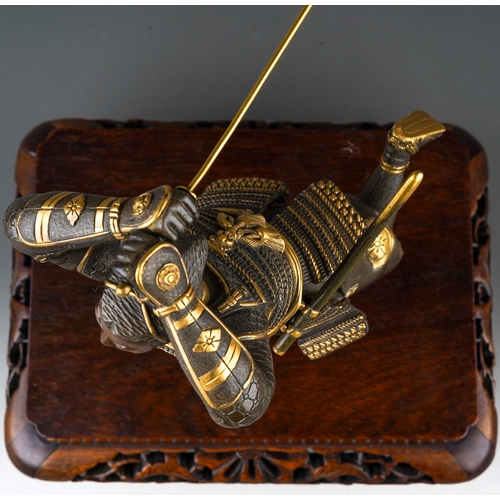 130 - A Japanese Meiji period (1868-1912) parcel gilt bronze figure of a Samurai warrior with sword, finel... 