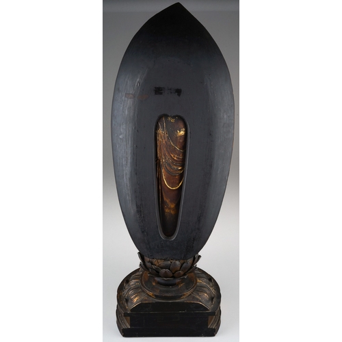 132 - An Edo period (1615-1868) lacquered giltwood figure of Amida Nyorai, glass urna, both hands in raigo... 