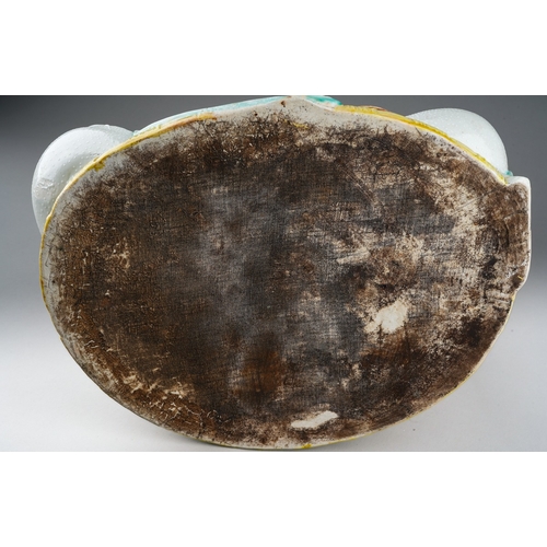 133 - A Japanese porcelain Satsuma figure of a seated Guanyin wearing a textured white robe and holding a ... 