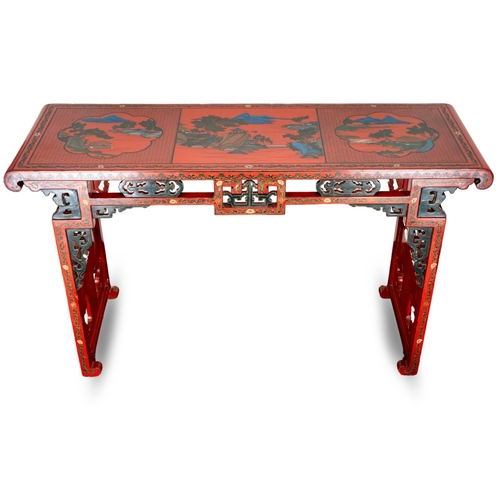 141 - A Chinese red lacquer carved altar table with a pierced frieze, the top decorated with mountainous l... 