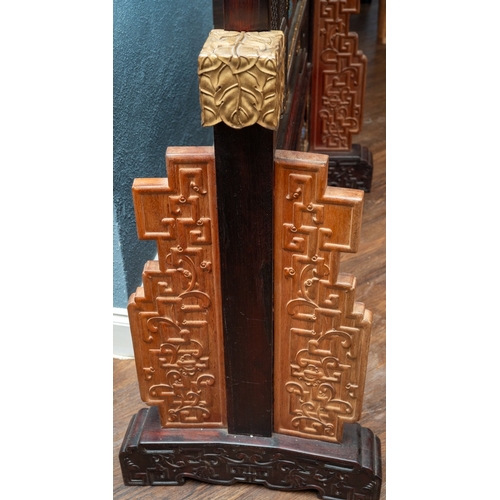 142 - A pair of 20th century Chinese floorstanding screens on separate stands, each decorated in the form ... 
