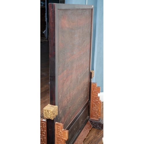 142 - A pair of 20th century Chinese floorstanding screens on separate stands, each decorated in the form ... 