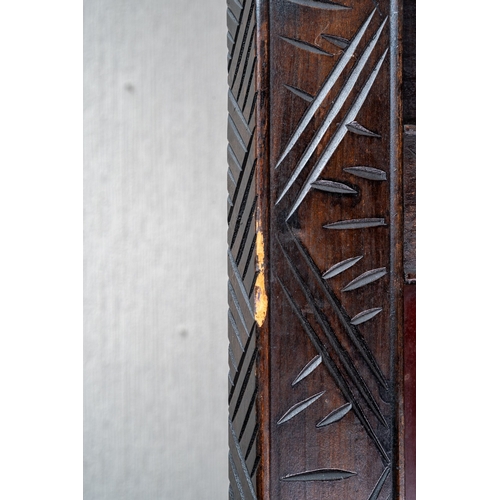 143 - A Japanese Meiji period shibayama two fold screen, fret tops above lacquer panels with applied carve... 