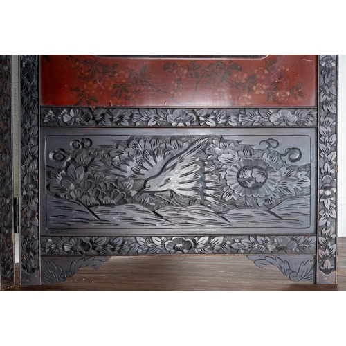 143 - A Japanese Meiji period shibayama two fold screen, fret tops above lacquer panels with applied carve... 