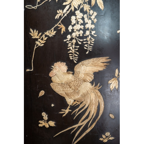 143 - A Japanese Meiji period shibayama two fold screen, fret tops above lacquer panels with applied carve... 