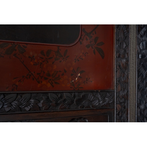 143 - A Japanese Meiji period shibayama two fold screen, fret tops above lacquer panels with applied carve... 
