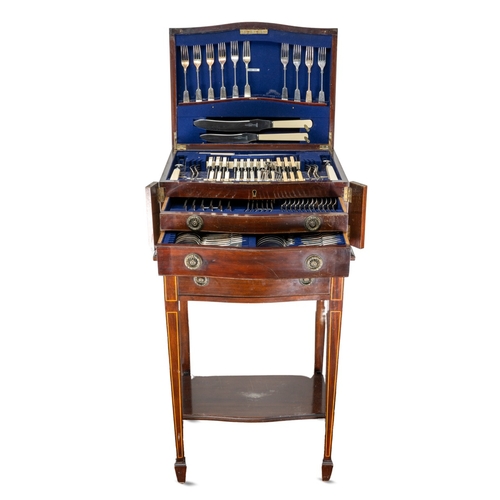 144 - An Edwardian  mahogany and satinwood banded serpentine fronted table canteen of silver plated Fiddle... 