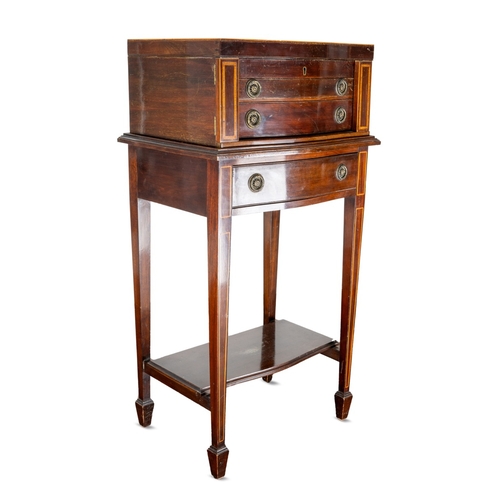 144 - An Edwardian  mahogany and satinwood banded serpentine fronted table canteen of silver plated Fiddle... 