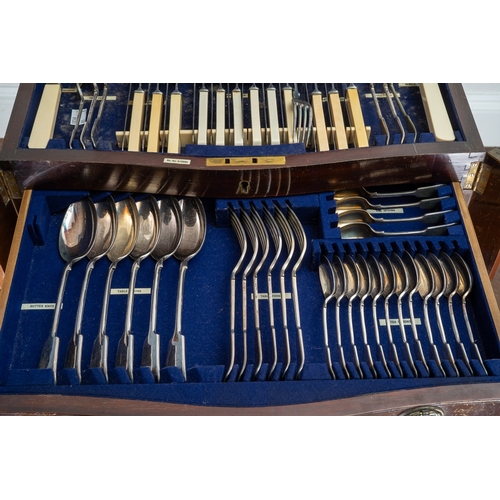 144 - An Edwardian  mahogany and satinwood banded serpentine fronted table canteen of silver plated Fiddle... 