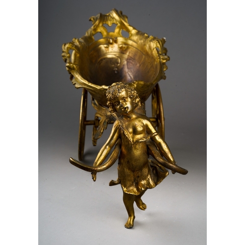 145 - An ormolu table centrepiece in the form of a shell shaped carriage being pulled by a young nymph, on... 