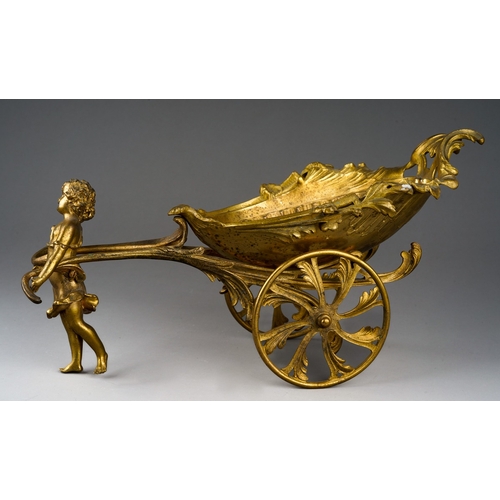 145 - An ormolu table centrepiece in the form of a shell shaped carriage being pulled by a young nymph, on... 