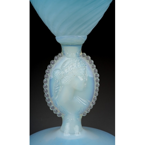 146 - An Italian blue and vaseline glass ewer, lattice and swirl decoration, rope twist handle, the stem m... 