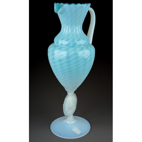 146 - An Italian blue and vaseline glass ewer, lattice and swirl decoration, rope twist handle, the stem m... 