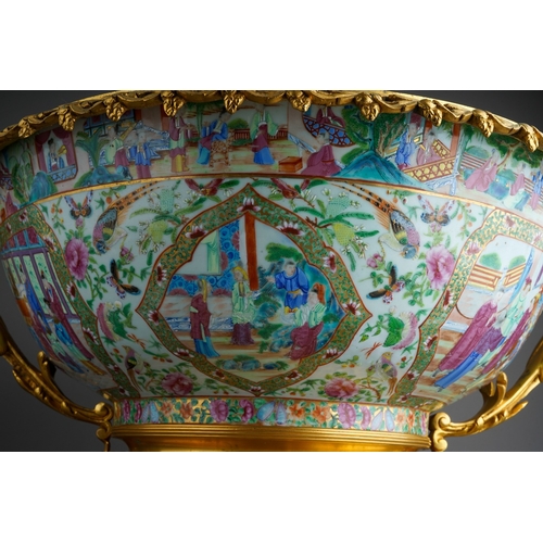 147 - A 19th century Chinese Canton porcelain famille rose and ormolu mounted punch bowl, the porcelain en... 