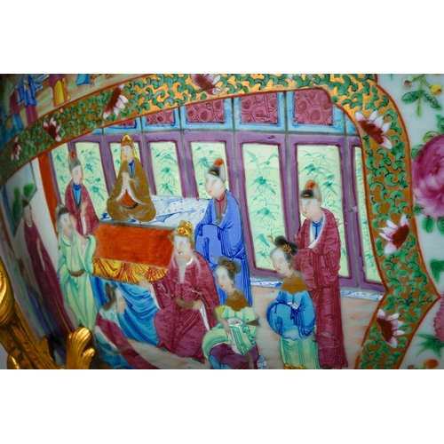 147 - A 19th century Chinese Canton porcelain famille rose and ormolu mounted punch bowl, the porcelain en... 