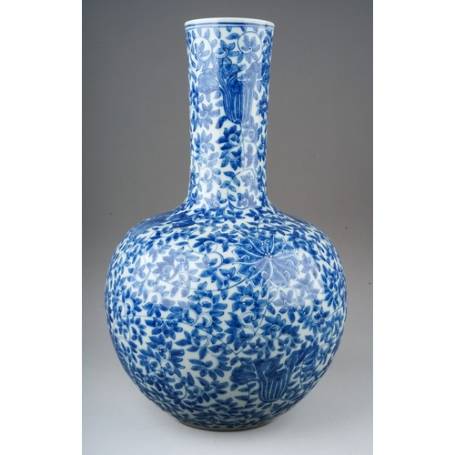 148 - A Chinese porcelain blue and white onion shaped vase, decorated throughout with flowers and foliate ... 