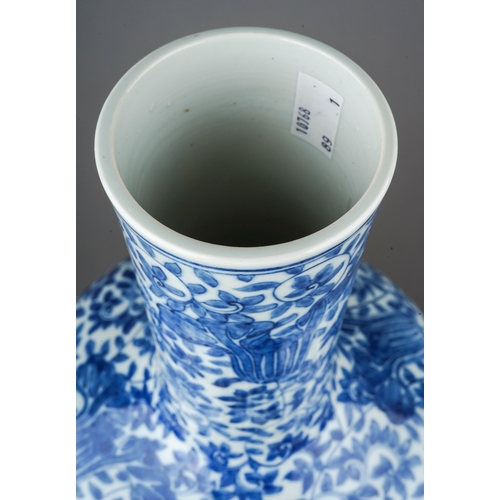 148 - A Chinese porcelain blue and white onion shaped vase, decorated throughout with flowers and foliate ... 