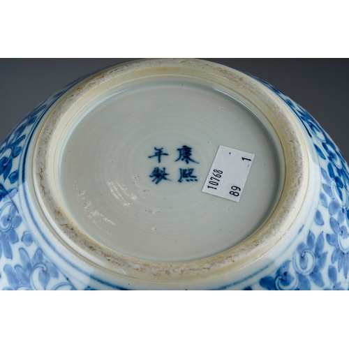 148 - A Chinese porcelain blue and white onion shaped vase, decorated throughout with flowers and foliate ... 