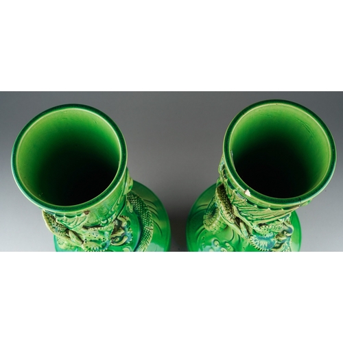 149 - A pair of Japanese Meiji period Awaji dragon vases of baluster form, green glazed and decorated in h... 