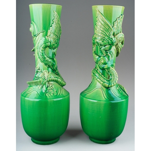 149 - A pair of Japanese Meiji period Awaji dragon vases of baluster form, green glazed and decorated in h... 