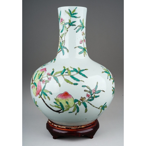 152 - A 20th century Chinese porcelain onion shaped vase, enamelled peaches on branches, seal mark to unde... 