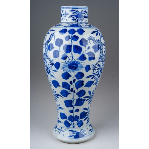 153 - A 19th century Chinese blue and white baluster vase decorated with two four clawed dragons amongst f... 
