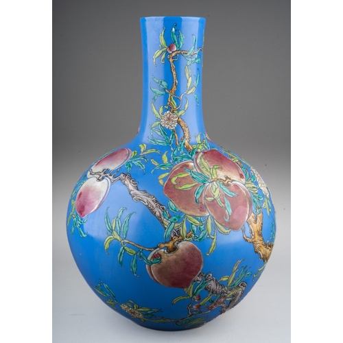 158 - A Chinese famille rose nine peaches vase, enamelled in shallow relief on a blue ground, turquoise gl... 