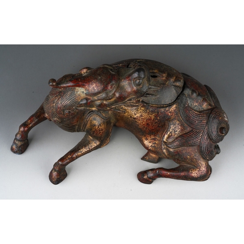 162 - A Japanese cast bronze koro in the form of a reclining Kirin, pierced cover, unsigned, height 16cm x... 